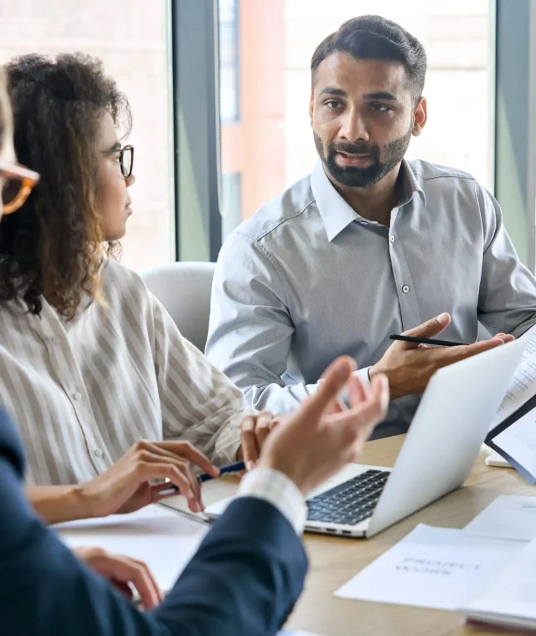 Consultant explaining a business process to a client during a meeting.